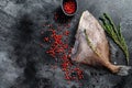 Raw fresh John Dory fish with spices and herbs for cooking. Black background. Top view. Copy space Royalty Free Stock Photo