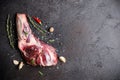 Raw fresh Lamb Meat shank and seasonings on black stone background Royalty Free Stock Photo