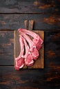 Raw fresh lamb ribs, on old dark  wooden table background, top view flat lay, with copy space for text Royalty Free Stock Photo