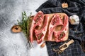 Raw fresh lamb ribs with pepper and thyme. Organic meat. White background. Top view Royalty Free Stock Photo