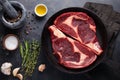 Raw fresh marbled meat Steak Ribeye Black Angus on black marble background. Beef with spices on a dark stone table. Top view Royalty Free Stock Photo