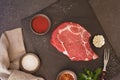 Raw fresh meat steak ribeye on dark surface Royalty Free Stock Photo