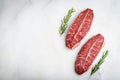 Raw fresh meat Top Blade steaks on light background. top view with copy space