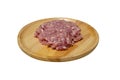 Raw fresh minced pork on a wooden plate isolated on white background with clipping path, side view Royalty Free Stock Photo