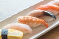 Raw and fresh nigiri sushi in white plate Royalty Free Stock Photo