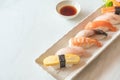 Raw and fresh nigiri sushi in white plate Royalty Free Stock Photo