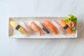 Raw and fresh nigiri sushi in white plate Royalty Free Stock Photo