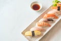 Raw and fresh nigiri sushi in white plate Royalty Free Stock Photo