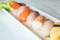 Raw and fresh nigiri sushi in white plate Royalty Free Stock Photo