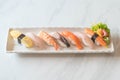 Raw and fresh nigiri sushi in white plate Royalty Free Stock Photo