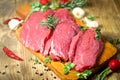 Raw, fresh organic beef meat with spices ready for baking - roasting Royalty Free Stock Photo