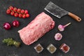 Raw fresh pork collar joint meat on black with spice, top view Royalty Free Stock Photo