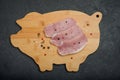 Raw fresh pork meat on wooden board on black background Royalty Free Stock Photo