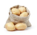 Raw fresh potatoes in burlap bag isolated on white Royalty Free Stock Photo