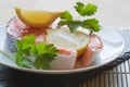 Raw fresh salmon cutlet steak with lemon and parsley garnish Royalty Free Stock Photo