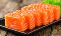 Raw fresh salmon sashimi served on black plate, Japanese food style Royalty Free Stock Photo