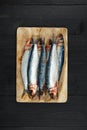 Raw fresh sardines and on the dark table Royalty Free Stock Photo
