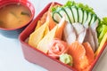 Raw fresh sashimi with rice in bento box