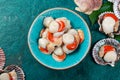 Raw fresh seafood shellfish scallops on blue background Royalty Free Stock Photo