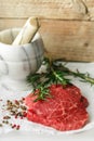 Raw fresh steaks from the marble beef, rosemary and spices on th Royalty Free Stock Photo