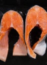 Raw, fresh trout steaks on a baking sheet with vegetable oil. Raw trout, red fish. Cooking trout in the oven at home as a healthy Royalty Free Stock Photo