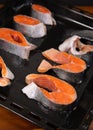Raw, fresh trout steaks on a baking sheet with vegetable oil. Raw trout, red fish. Cooking trout in the oven at home as a healthy Royalty Free Stock Photo