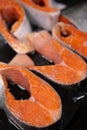 Raw, fresh trout steaks on a baking sheet with vegetable oil. Raw trout, red fish. Cooking trout in the oven at home as a healthy Royalty Free Stock Photo