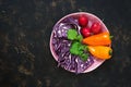 Raw fresh vegetables, red cabbage, radish, sweet yellow pepper, coriander on a dark background. Top view, copy space. Royalty Free Stock Photo