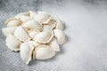 Raw frozen dumplings pierogi on a kitchen table. White background. Top View. Copy space Royalty Free Stock Photo