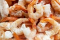 Raw frozen and peeled shrimp background. Pile of frozen shrimps .Close-up of frozen shrimps. A lot of royal shrimp macro shot