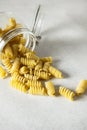 Raw Fusili Pasta Glass Jar Gray Background Vertical Italian Food Royalty Free Stock Photo