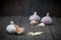 Raw garlic bulbs on wooden table Royalty Free Stock Photo