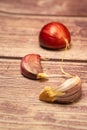 Raw Garlic Cloves On A Wooden Background. Close Up