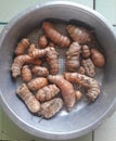 Raw ginger root in aluminum sieve bowl. Royalty Free Stock Photo