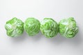 Raw green cabbages on white background, flat lay Royalty Free Stock Photo