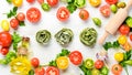 Raw green pasta with tomatoes, oil and parsley on white wooden background. Italian traditional cuisine. Fresh vegetables. Royalty Free Stock Photo