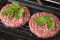 Raw Ground beef meat Burger steak cutlets fried on a hot grill. Cutlet for burger with vegetables and spices. fast food Royalty Free Stock Photo