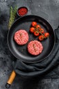 Raw Ground beef meat Burger steak cutlets in a pan. Black background. Top view Royalty Free Stock Photo