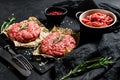 Raw Ground beef meat Burger steak  cutlets and seasonings. Farm organic meat. Black background. Top view Royalty Free Stock Photo