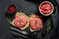 Raw Ground beef meat Burger steak cutlets and seasonings. Farm organic meat. Black background. Top view Royalty Free Stock Photo