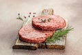 Raw Ground beef meat Burger steak cutlets on a wooden board, Food recipe background. Close up Royalty Free Stock Photo