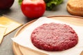 Raw Ground beef meat Burger steak cutlets on wooden table Royalty Free Stock Photo