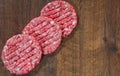 Raw Ground beef meat Burger steak on wooden table with copy space. top view Royalty Free Stock Photo