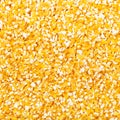 Raw ground corn groats close up