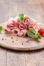 Raw Ham rolls on wooden table Royalty Free Stock Photo