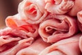 Raw Ham rolls on wooden table Royalty Free Stock Photo