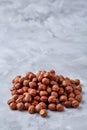 Raw hazelnut on heap isolated on white background, selective focus, shallow depth of field