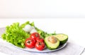Raw healthy vegetarian food. Vegetables, mozzarella and olive oil on white background, close up Royalty Free Stock Photo