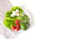 Raw healthy vegetarian food. Vegetables, mozzarella and olive oil on white background, top view Royalty Free Stock Photo