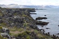 Hiking trail from Anarstapi to Hellnar with the raw ocean und big rocks and mountains in the west of Iceland at Snaefellsnes Penin